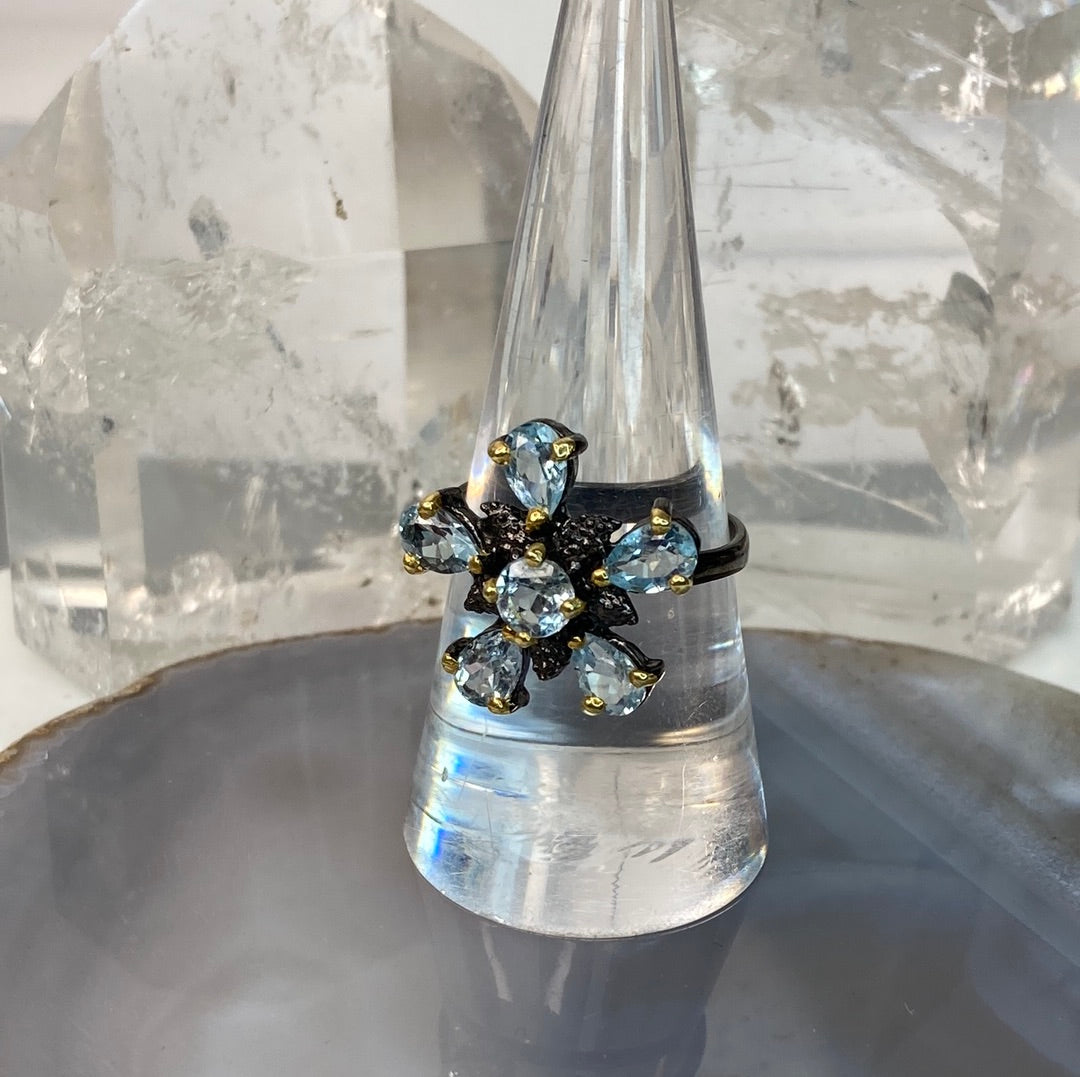 Sterling silver blue topaz flower ring