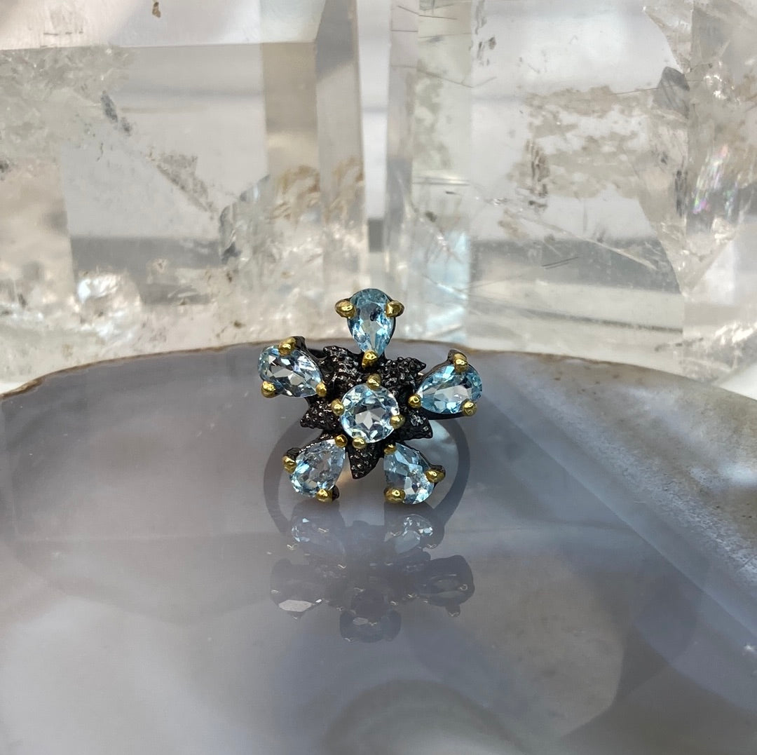 Sterling silver blue topaz flower ring